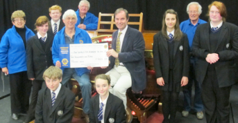 Receiving a donation from the Rye Rotary Club